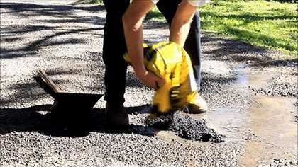 Repairing a Pothole - use Asphalt in a bag